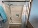 Bright shower area with a standard shower head and a decorative shower curtain at 358 Pool Rock Shores Ln, Henderson, NC 27537
