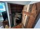 Unique storage closet with a custom wood door, blending seamlessly with the interior decor at 358 Pool Rock Shores Ln, Henderson, NC 27537