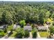 Aerial shot of homes with green lawns, mature trees, and well-maintained streets in a suburban setting at 3620 Arrowwood Dr, Raleigh, NC 27604