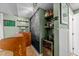 Basement bar area featuring a custom-built bar, chalkboard wall, shelving and a beverage cooler at 3620 Arrowwood Dr, Raleigh, NC 27604