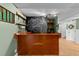 Basement bar area featuring a custom-built bar, chalkboard wall, glass shelving, and decor at 3620 Arrowwood Dr, Raleigh, NC 27604
