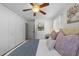 Bedroom view with ceiling fan, a closet, and wood flooring at 3620 Arrowwood Dr, Raleigh, NC 27604