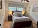 Comfortable bedroom with hardwood floors, a ceiling fan, and a patterned area rug at 3620 Arrowwood Dr, Raleigh, NC 27604
