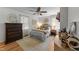 Cozy bedroom with ceiling fan, a decorative rug, and a dresser at 3620 Arrowwood Dr, Raleigh, NC 27604