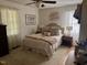 Cozy bedroom with soft natural lighting, complemented by a decorative bed and neutral tones at 3620 Arrowwood Dr, Raleigh, NC 27604