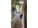 Charming entryway featuring a brick floor, modern lighting, and an inviting front door at 3620 Arrowwood Dr, Raleigh, NC 27604