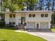 Charming two-story home with brick accents, attached garage, and well-maintained lawn at 3620 Arrowwood Dr, Raleigh, NC 27604