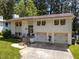 Two-story home with an attached garage, flower boxes, a well-manicured lawn, and a walkway at 3620 Arrowwood Dr, Raleigh, NC 27604