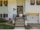 Charming home featuring a welcoming front entrance with a wreath and a well-maintained yard at 3620 Arrowwood Dr, Raleigh, NC 27604