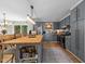 Well-designed kitchen featuring a butcher block island, blue cabinets, and stainless steel appliances at 3620 Arrowwood Dr, Raleigh, NC 27604