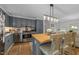 Modern kitchen features stainless appliances, butcher block island, and pendant lighting at 3620 Arrowwood Dr, Raleigh, NC 27604