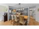 Stylish kitchen with a large butcher block island, modern lighting, and stainless appliances at 3620 Arrowwood Dr, Raleigh, NC 27604