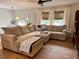 Comfortable living room with a large sectional sofa, neutral decor, and natural light at 3620 Arrowwood Dr, Raleigh, NC 27604