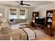 Inviting living room featuring a sectional sofa, hardwood floors, and built in shelving at 3620 Arrowwood Dr, Raleigh, NC 27604