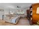 Spacious living room featuring a large sectional sofa, ceiling fan, and decorative shelving unit at 3620 Arrowwood Dr, Raleigh, NC 27604