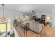 Cozy living room featuring a comfortable sectional sofa, and hardwood floors with lots of natural light at 3620 Arrowwood Dr, Raleigh, NC 27604