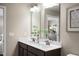 Well lit bathroom with a double sink vanity, neutral paint, and modern fixtures at 408 Grand Silo Rd, Garner, NC 27603