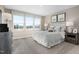 Bright bedroom with many windows, neutral tones, carpeted floors and complementary decor at 408 Grand Silo Rd, Garner, NC 27603