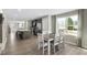Bright, open-concept kitchen and dining area with modern finishes and abundant natural light from a large window at 408 Grand Silo Rd, Garner, NC 27603