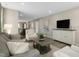 Open-concept living area with comfortable seating, modern decor, and easy access to the kitchen and dining spaces at 408 Grand Silo Rd, Garner, NC 27603