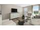 Cozy living room featuring comfortable seating, a stylish coffee table, and a well-lit entryway, creating a welcoming ambiance at 408 Grand Silo Rd, Garner, NC 27603