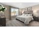 Serene main bedroom with a plush bed, soft lighting, and views from the window creating a relaxing atmosphere at 408 Grand Silo Rd, Garner, NC 27603