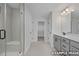 Bathroom featuring tiled shower and gray vanity at 412 Longleaf Glen Lane, Zebulon, NC 27597