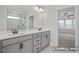Bathroom with double vanity, tile floors, a glass shower, and a view into the bedroom at 412 Longleaf Glen Lane, Zebulon, NC 27597