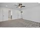 Bright primary bedroom with ensuite bathroom, carpeted floors and a ceiling fan at 412 Longleaf Glen Lane, Zebulon, NC 27597