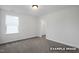 Neat bedroom features carpeted floors, a bright window, and a closet for optimal space and functionality at 412 Longleaf Glen Lane, Zebulon, NC 27597