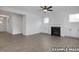 Bright and spacious living room with hardwood floors, a fireplace, built-in cabinets, and ample natural light at 412 Longleaf Glen Lane, Zebulon, NC 27597