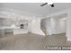 Open layout showing the kitchen and living room with stairs and hardwood flooring at 412 Longleaf Glen Lane, Zebulon, NC 27597