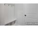 The mudroom features hooks for jackets and a bench with cubbies for shoes at 412 Longleaf Glen Lane, Zebulon, NC 27597