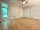 Primary bedroom featuring luxury vinyl plank flooring, double closets, and bright window at 4120 Sedgewood Dr # 106, Raleigh, NC 27612