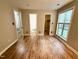 Bedroom with wood style flooring that leads to the closet and the bathroom at 4120 Sedgewood Dr # 106, Raleigh, NC 27612