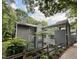 Three story exterior view of building with gray siding and upper level outdoor walkways at 4120 Sedgewood Dr # 106, Raleigh, NC 27612