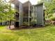 This three-story condo building has multiple balconies and outdoor access at 4120 Sedgewood Dr # 106, Raleigh, NC 27612