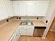 Kitchen features stainless steel dishwasher, undermount sink, and countertop at 4120 Sedgewood Dr # 106, Raleigh, NC 27612