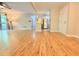 Open concept living room with wood flooring and an entrance doorway, with natural light at 4120 Sedgewood Dr # 106, Raleigh, NC 27612