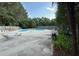 This community pool is surrounded by a fence and has chairs for lounging at 4120 Sedgewood Dr # 106, Raleigh, NC 27612