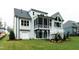 Beautiful backyard with a screened porch, patio, and ample green space, perfect for outdoor living at 46 Addison Pond Ct, Zebulon, NC 27597