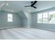 Spacious bonus room has neutral paint, large windows and recessed lights at 46 Addison Pond Ct, Zebulon, NC 27597