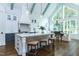 Open kitchen with large island, stylish pendant lights, and adjacent dining area at 46 Addison Pond Ct, Zebulon, NC 27597