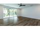 Bright living room with hardwood floors and sliding glass doors to the backyard at 46 Addison Pond Ct, Zebulon, NC 27597