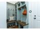 Mudroom featuring built-in storage, seating, and convenient hooks, ideal for organization at 46 Addison Pond Ct, Zebulon, NC 27597