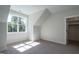 Well-lit bedroom featuring neutral paint, a window, and closet at 476 Mollie Meadow Dr, Zebulon, NC 27597