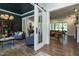 Open-concept living space with elegant furniture and bright, airy atmosphere showcasing an open doorway at 476 Mollie Meadow Dr, Zebulon, NC 27597