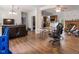 Spacious living room with hardwood floors, fireplace, and open access to kitchen at 5019 Dorsey Rd, Oxford, NC 27565