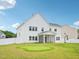 A large backyard with a fenced yard and a putting green at 514 Bonville Ct, Fuquay Varina, NC 27526