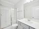 Clean bathroom featuring a glass shower door, modern sink and toilet, and neutral color tones at 514 Bonville Ct, Fuquay Varina, NC 27526